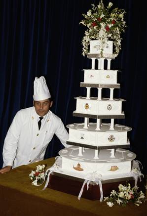 Chief petty officer cook David Avery with the royal wedding cake made for 